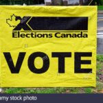 yellow-and-black-elections-canada-vote-sign-displayed-on-a-roadway-in-maple-ridge-british-columbia-canada-2GEEBT6